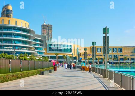 Dubai, UAE - February 01, 2020: Promenade around the Dubai Fountain near the Dubai Mall,  United Arab Emirates Stock Photo
