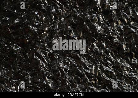 Effective, contrasting background obtained from creased aluminum foil. Stock Photo
