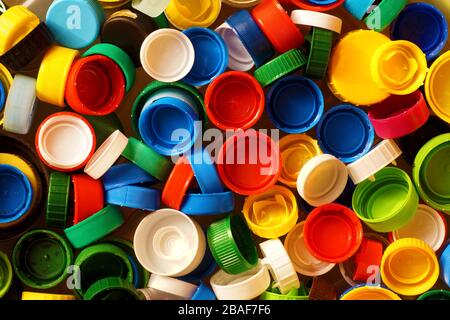 Different colored caps from bottles, great raw material for recycling. Stock Photo
