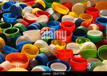 Macro photo. Different colored caps from bottles, great raw material for recycling. Stock Photo