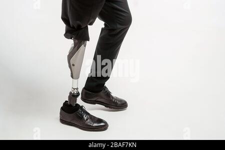 Disabled young man with prosthetic leg, artificial limb concept Stock Photo