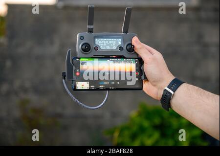 Abertillery,Gwent,south wales27 march 2020- Male holding dji mavic controller over looking beautiful sunsnet .hyperlapse Stock Photo