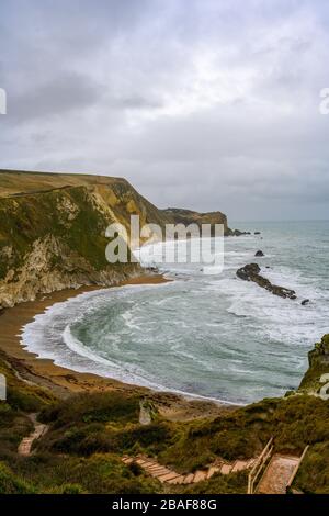 Portait view of Man O War Bay in Dorset with beautiful wave patterns on the beach Stock Photo