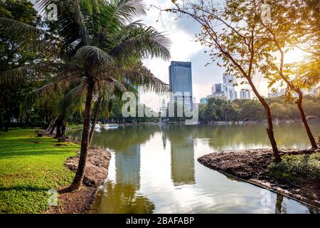 Lake in the heart of Business district in public Lumpini park of Bangkok, Thailand Stock Photo