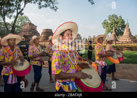 traditional dresst thai people at the Loy Krathong Festival in front of the Wat mahathat in the Historical Park in Sukhothai in the Provinz Sukhothai Stock Photo