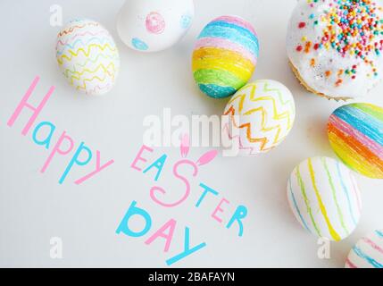 Easter. Colored eggs and cakes. Lettering, congratulations. Design for postcards. Stock Photo