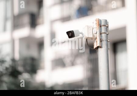 Security CCTV camera on pole in condominium building, Security camera concept Stock Photo