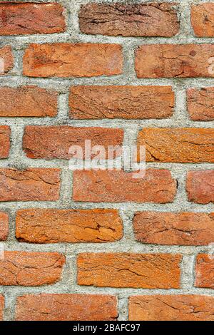 Vertical close-up shot of a hundred year old brick wall.  Good background.  Copy space. Stock Photo