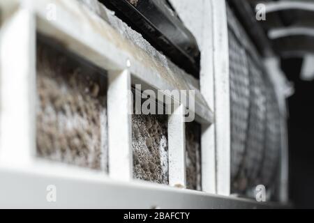 Dirty split air conditioner with dust and fungus. Close-up on a air conditioner that needs cleaning. Stock Photo