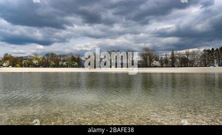 Storm sky over empty Bundek lake in Zagreb due to Corona virus epidemy Stock Photo
