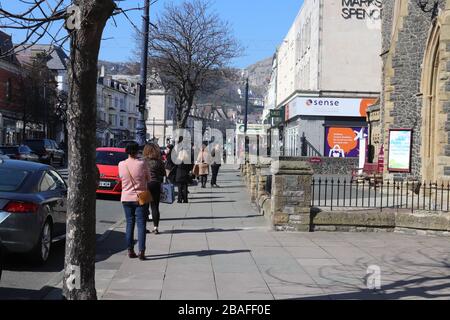 Llandudno Friday 27 March, Social Distancing. Queuing outside supermarkets numbers of shoppers are being limited, as supermarkets are enforcing the two metres rule, also customers are being ask to pay by card to avoid handing cash. Credit : Mike Clarke/ Alamy Live News Stock Photo