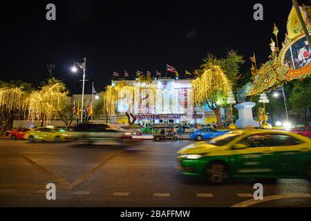 BANGKOK/THAILAND - December 5: Rajadamnern Boxing Stadium night view street in the city near old quarter Many people are waiting to see the show Compe Stock Photo