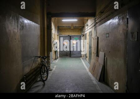 An Interior view of an old factory in which Urbicum workshop is located. Currently the building is used as a share space for startups and avant-garde contemporary art gallery.Polish engineers from Krakow-based Company Urbicum created VentilAid - a working prototype of a ventilator which can be printed on a 3D printer. Currently, several dozen teams around the world are working on modifying the design and introducing the device to effective production. It is intended as a last resort in case of lack of professional equipment. It’s simple design and widely available materials make it easy to man Stock Photo