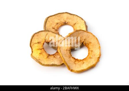Oven dried crispy yellow apples on a white background Stock Photo