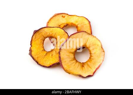 Oven dried crispy red apples on a white background Stock Photo