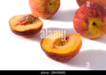 Pieces of peach fruit isolated on white background Stock Photo