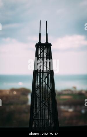 Statue of Chicago's John Hancock Building overlooking Grant park and  Lake Michigan Stock Photo