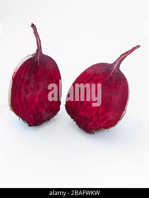 Cut into two parts red beet on white background Stock Photo