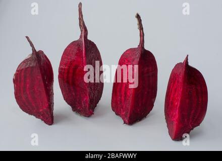 Cut into four pieces red beet isolated on white background Stock Photo