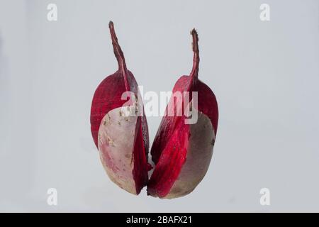 Cut into four pieces red beet isolated on white background Stock Photo