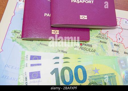 Holiday planning concept, passports and currency over the map Stock Photo