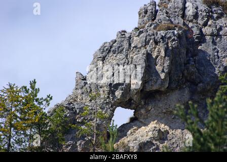 Natural rock hole in the mountain Stock Photo