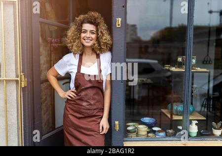 Portrait of woman pottery artist in art studio Stock Photo