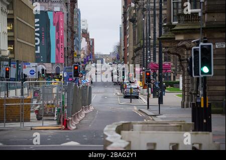 Glasgow, UK. 27th Mar, 2020. Pictured: Views of Glasgow City Centre showing empty streets, shops closed and empty railway stations during what would normally be a busy street scene with shoppers and people working within the city. The Coronavirus Pandemic has forced the UK Government to order a shut down of all the UK major cities and make people stay at home. Credit: Colin Fisher/Alamy Live News Stock Photo