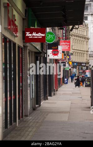 Glasgow, UK. 27th Mar, 2020. Pictured: Views of Glasgow City Centre showing empty streets, shops closed and empty railway stations during what would normally be a busy street scene with shoppers and people working within the city. The Coronavirus Pandemic has forced the UK Government to order a shut down of all the UK major cities and make people stay at home. Credit: Colin Fisher/Alamy Live News Stock Photo