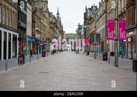 Glasgow, UK. 27th Mar, 2020. Pictured: Buchanan Street - Glasgows style mile, which is now like a ghost town. Views of Glasgow City Centre showing empty streets, shops closed and empty railway stations during what would normally be a busy street scene with shoppers and people working within the city. The Coronavirus Pandemic has forced the UK Government to order a shut down of all the UK major cities and make people stay at home. Credit: Colin Fisher/Alamy Live News Stock Photo