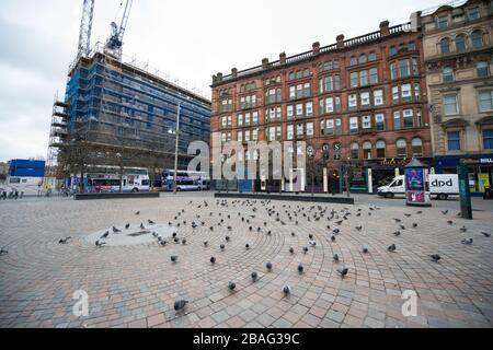 Glasgow, UK. 27th Mar, 2020. Pictured: Views of Glasgow City Centre showing empty streets, shops closed and empty railway stations during what would normally be a busy street scene with shoppers and people working within the city. The Coronavirus Pandemic has forced the UK Government to order a shut down of all the UK major cities and make people stay at home. Credit: Colin Fisher/Alamy Live News Stock Photo