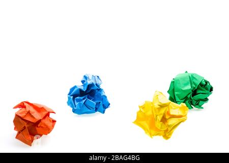 Colored crumpled paper ball over white, focus on second row Stock Photo