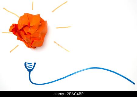 Crumpled paper ball as light bulb, creative idea Stock Photo