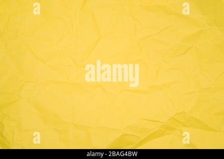Texture of yellow crumpled paper, close image Stock Photo