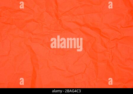 Red crumpled paper as texture, close up image Stock Photo