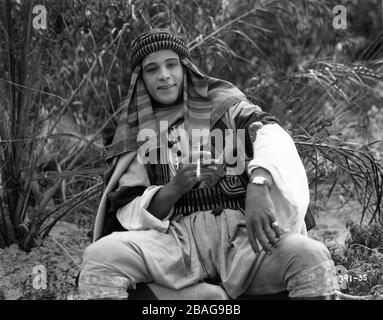 RUDOLPH VALENTINO on set location candid in costume as Ahmed Ben