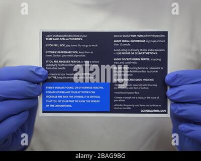 Los Angeles, CA / USA - March 25, 2020: The back of a White House postcard mailer provides social and hygiene tips related to the COVID-19 coronavirus. Stock Photo