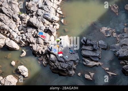 Africa, Ethiopia. A man is cleaning his laundry in a river outside Addis Ababa Stock Photo