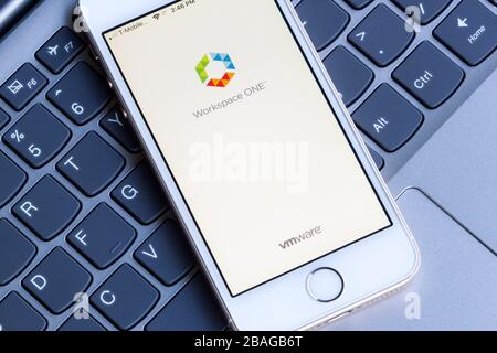 VMware Workspace ONE mobile app welcome interface is seen on a smartphone. VMware Workspace ONE is a cloud-based enterprise-class management platform. Stock Photo