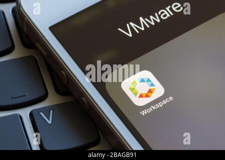 VMware Workspace ONE mobile app icon closeup. It allows IT administrators to control end users' mobile devices and cloud-hosted virtual desktop & apps. Stock Photo