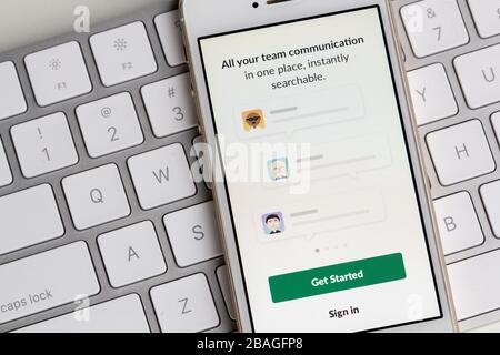 Slack mobile app login screen is seen on a smartphone. Slack is a B2B software, workplace messenger, team communication tool or platform. Stock Photo