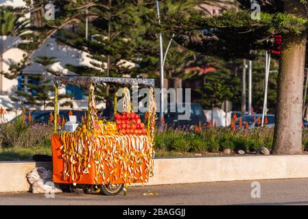 Fresh fruit juices, lemonade vendor stand, Essaouira, Morocco. With selective focus Stock Photo