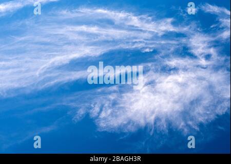 Cirrus clouds in deep blue sky with nature patterns. Stock Photo