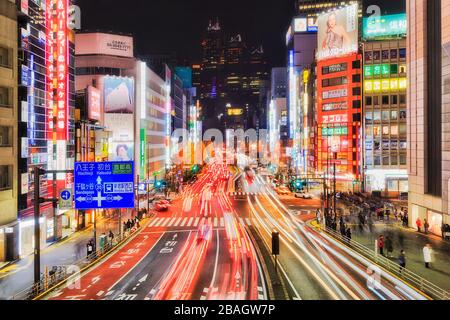 Tokyo, Japan - 31 Dec 2019: Tokyo city in Japan around Shinjuku-Shibuya business districts at night with bright illuminations and crowds of people cro Stock Photo