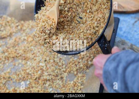 making bird seed with cereal and oil, series picture 3/4 Stock Photo