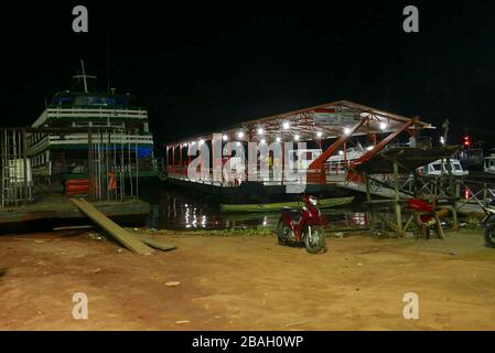 The AJATO  terminal for the ferry to Manaus in Tefe on the Upper Amazon in Brazil. The boat left is a traditional riverboat NOT the speed ferry Stock Photo