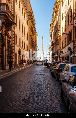 A view down a street in Rome, Italy towards the Spanish Steps and Obelisk Sallustiano. Stock Photo