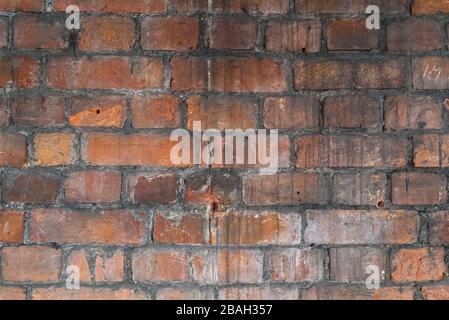 texture old red brick wall laid out at the beginning of the 18th century. Beautiful antique texture Stock Photo