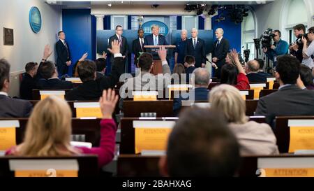 Washington, United States Of America. 21st Mar, 2020. President Donald J. Trump, joined by members of the White House Coronavirus Task Force, takes questions from reporters during a coronavirus update briefing Saturday, March 21, 2020, in the James S. Brady Press Briefing Room of the White House. People: President Donald J. Trump Credit: Storms Media Group/Alamy Live News Stock Photo