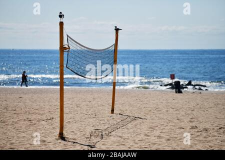 Close up view of an unused volleyball net during the off season tranquility on the beach of Coney Island w Stock Photo